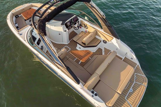 Sea Ray 230 SDX OB moored in a scenic coastal location